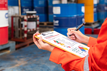 Worker checking hazardous chemical information